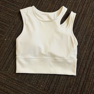 lululemon workout top. super cute! only worn once. the shoulder has a cut out